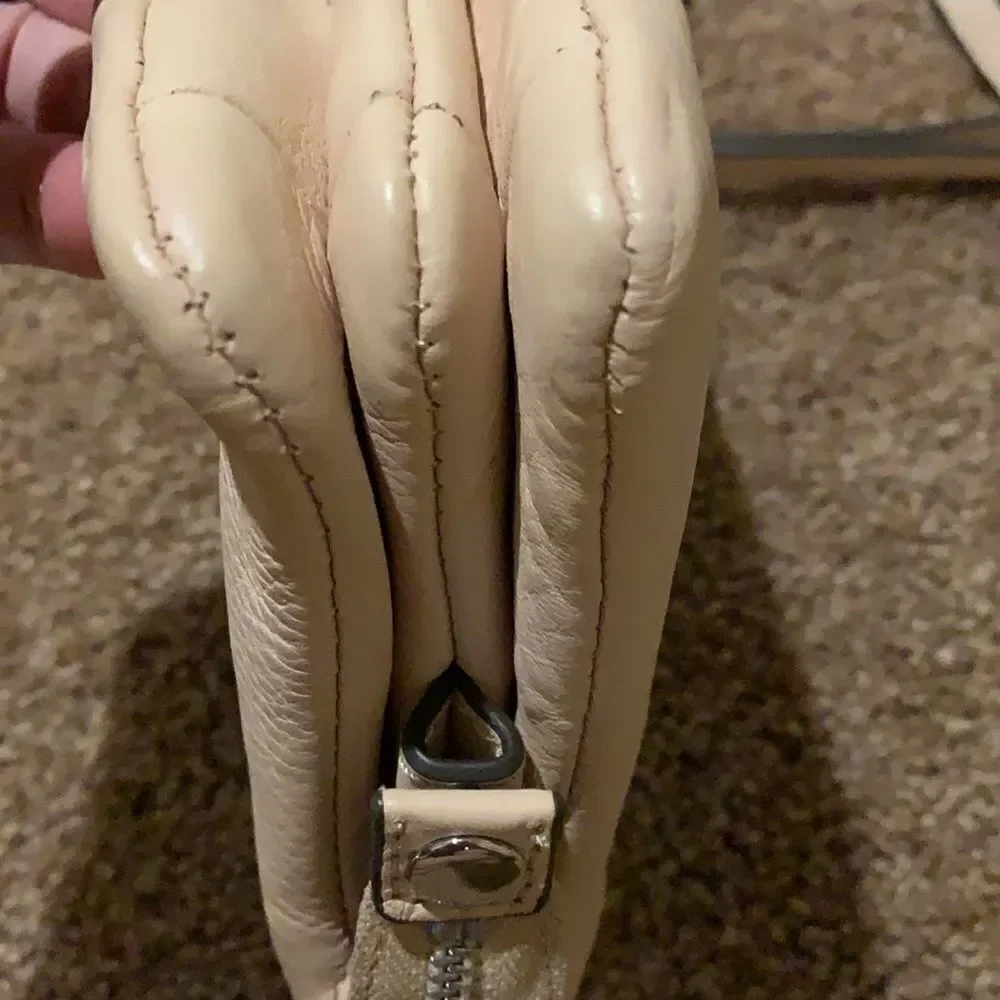 Vince Camuto soft pink crossbody wristlet.